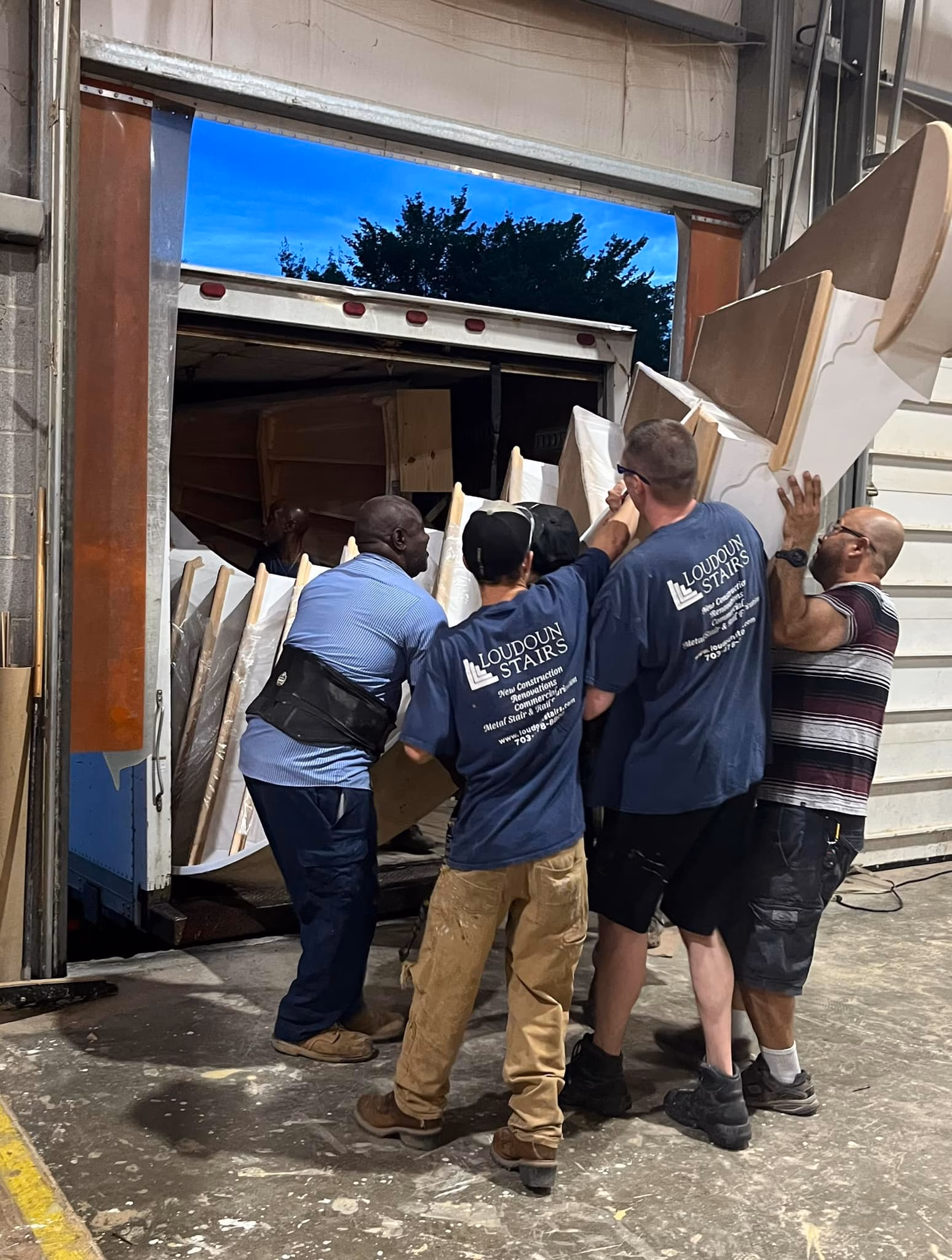 Loudoun Stairs team loading stair components into a delivery truck